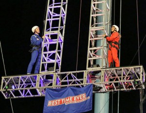 stunt with reese witherspoon and neil patrick harris on latter red and blue jumpsuits