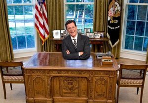 Stephen Colbert sitting in the Oval office
